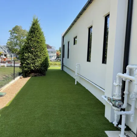 a white house with a lawn