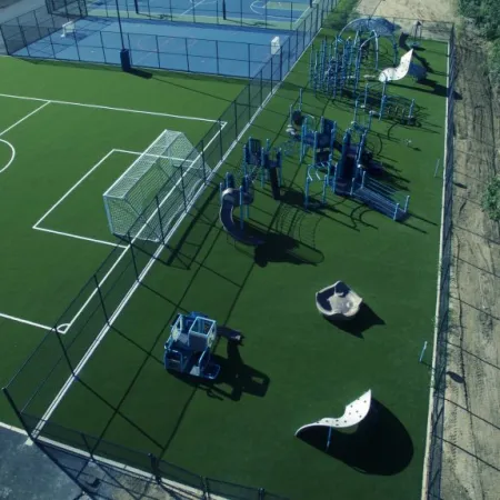 a football field with a car parked on the side