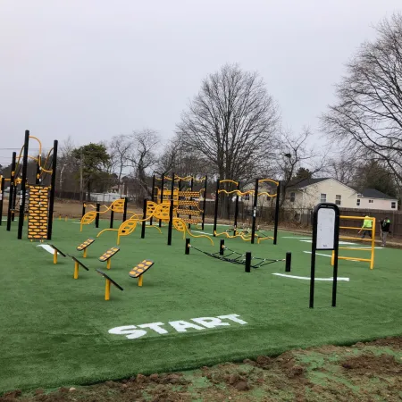 a playground with yellow and black bars