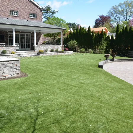 a large green lawn in front of a house