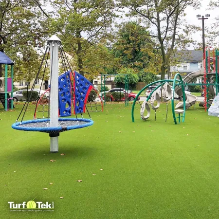 a playground with a slide and a flag