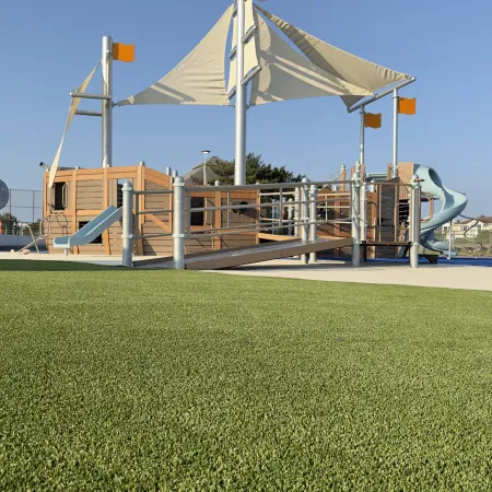 a white tent on a green lawn