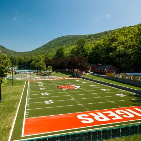 a football field with a red track
