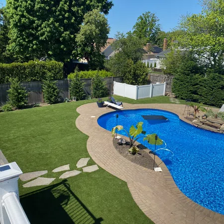 a backyard with a pool and a slide