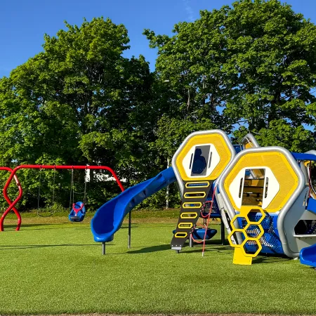 a yellow and blue playground toy