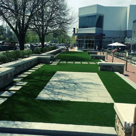 a courtyard with a building in the background
