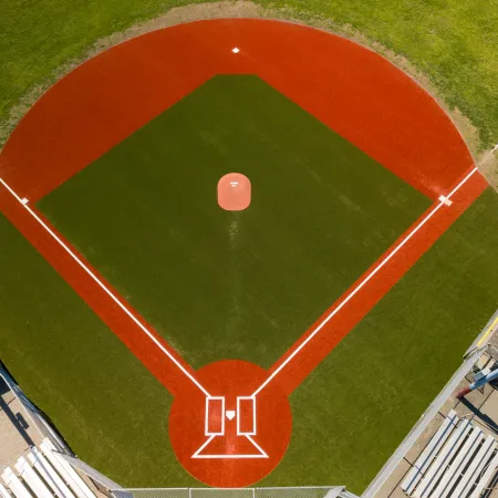 a football field with a red and white circle in the center