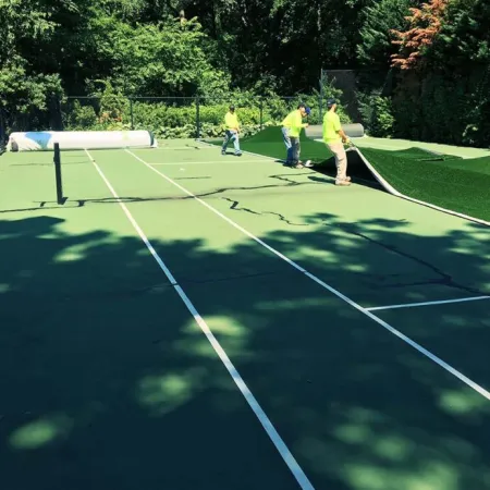 a group of people play tennis