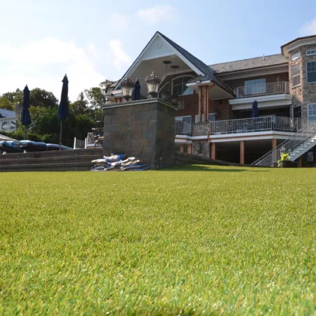 a large building with a lawn in front of it