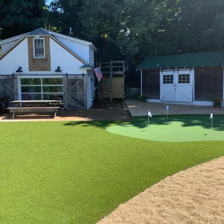 a golf course with a building in the background