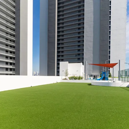 a green lawn in front of a building