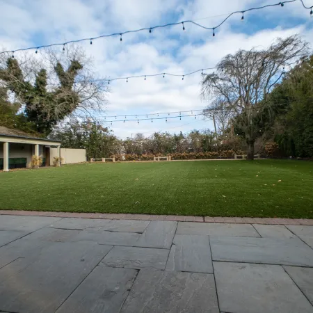 a house with a lawn and trees