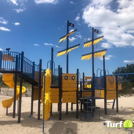 a playground with yellow and black bars