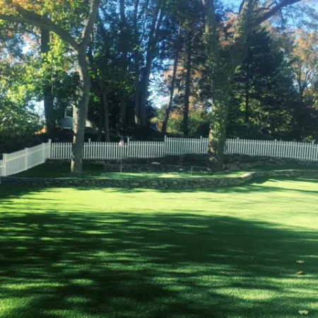 a fenced in yard with trees