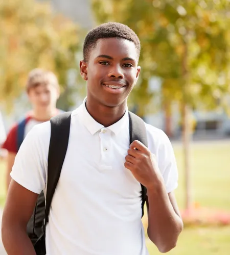 a person with a backpack smiling