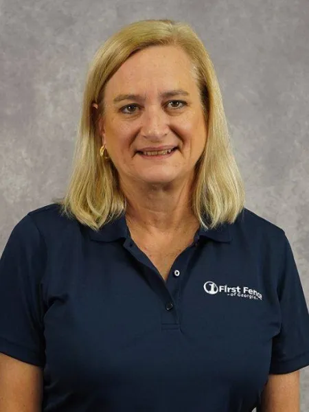 A woman in a blue shirt