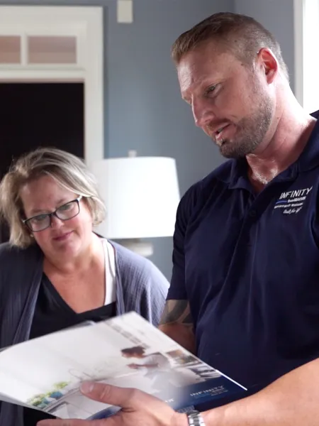 Infinity from Marvin by North Georgia Replacement Windows Design Consultant presenting a proposal to a homeowner.