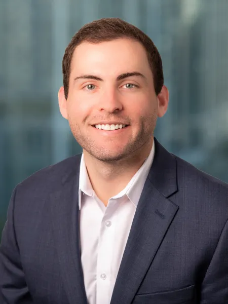 a man in a suit smiling