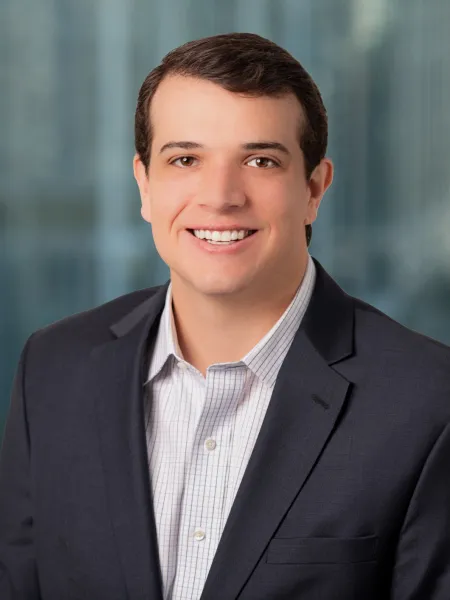 a man in a suit smiling