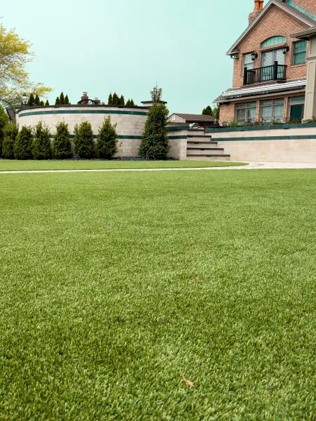 a large green lawn in front of a house