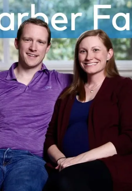 The Garber family smiling and sitting on a couch inside a home with PV Heating & Air logo.