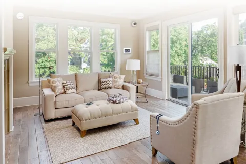 a living room with a large glass door