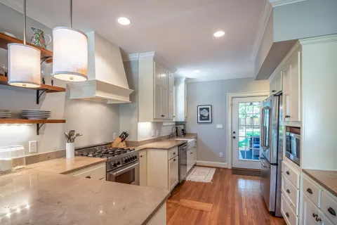 a kitchen with white cabinets
