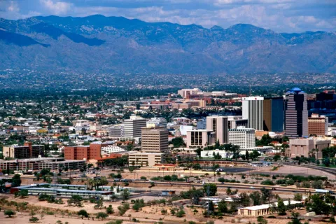 a city with mountains in the background