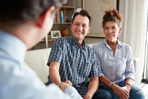 a couple sitting on a couch