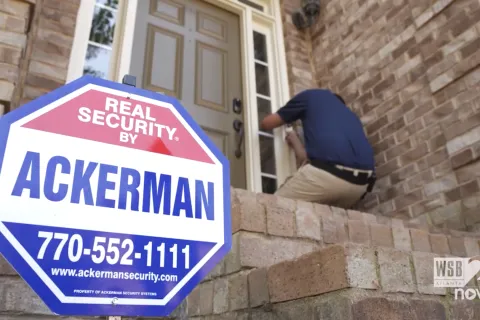 an Ackerman sign in the front of a house