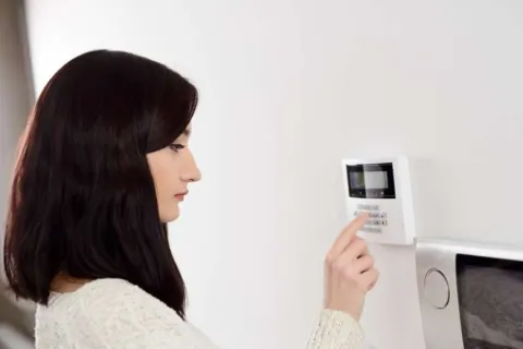 a woman looking at a device