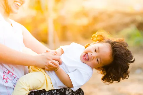 a person holding a baby