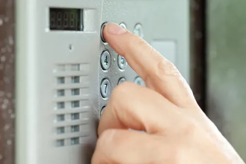 a hand holding using a device