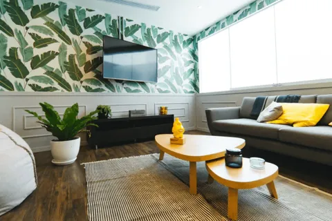 a living room with a tv and couches