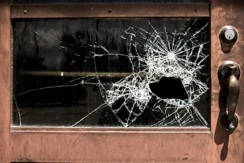 a broken glass on a door