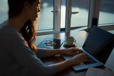 a woman working on her laptop