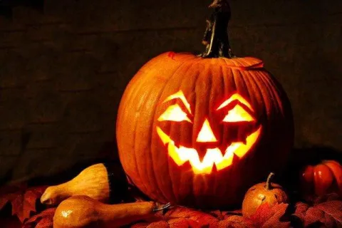 a carved pumpkin with a candle inside