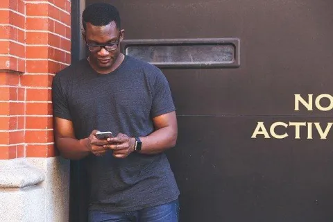 a man looking at his phone
