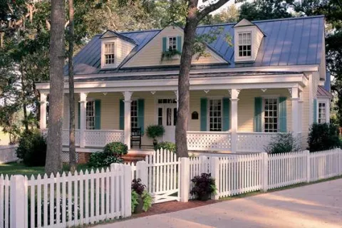 a white house with a fence