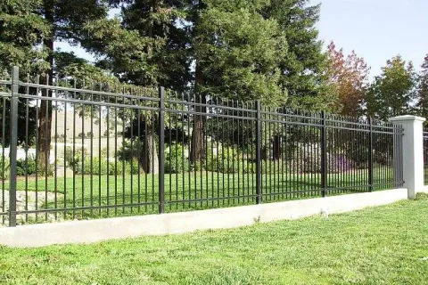 a fenced in area with trees