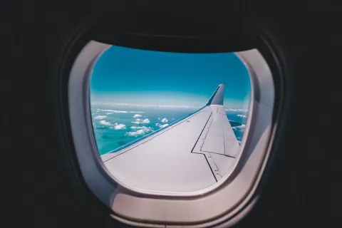 an airplane wing in the sky