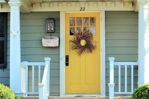 a yellow door on a house