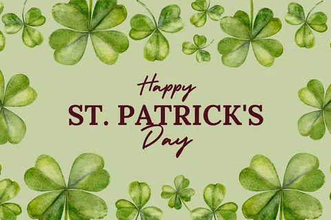 Green watercolor shamrocks framing Happy St. Patrick's Day text on a light green background for festive design.
