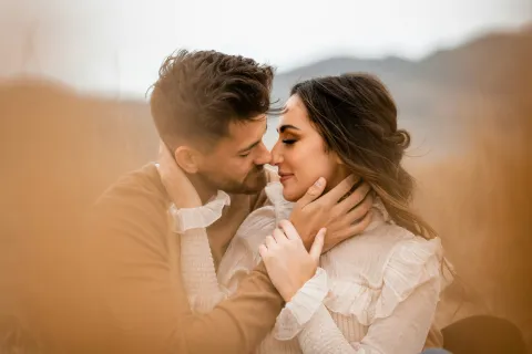 a man and woman kissing