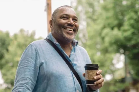 a man holding a coffee cup
