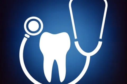 White stethoscope encircling a tooth on a blue background, symbolizing dental health and care.