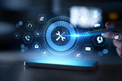 Hand holding stylus interacting with smartphone displaying digital settings and support icons hologram.