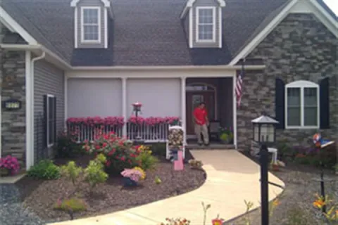 a person standing in the doorway of a house
