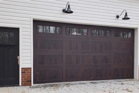 a garage door with a light above it