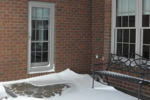 a bench in the snow